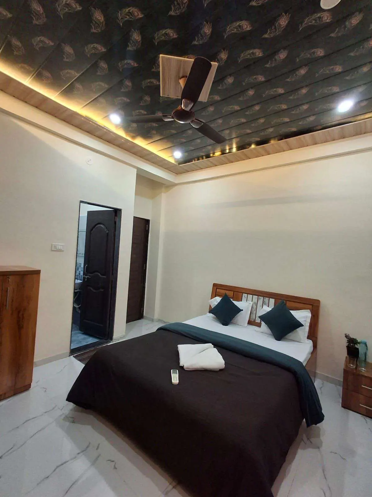 Air-conditioned bedroom in Shuubh Aavishkar 2BHK Villa, a 2 BHK villa in Lonavala on rent