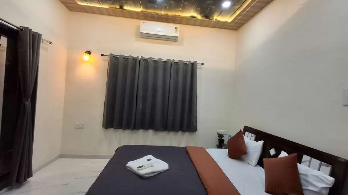 Air-conditioned bedroom in Shuubh Aavishkar 2BHK Villa, a 2 BHK villa in Lonavala on rent