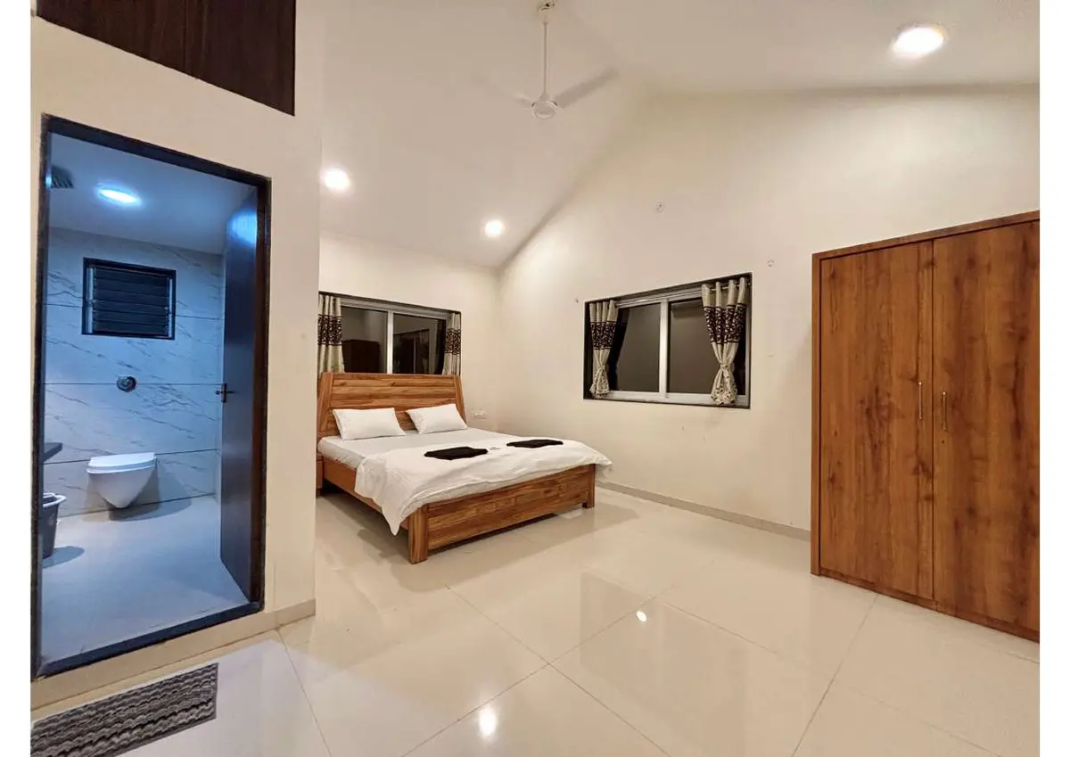 Air-conditioned bedroom in Duke's Nose Villa, a 4 BHK villa in Lonavala on rent