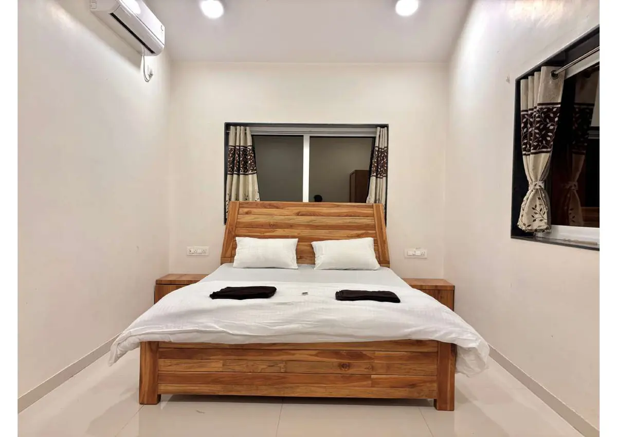 Air-conditioned bedroom in Duke's Nose Villa, a 4 BHK villa in Lonavala on rent