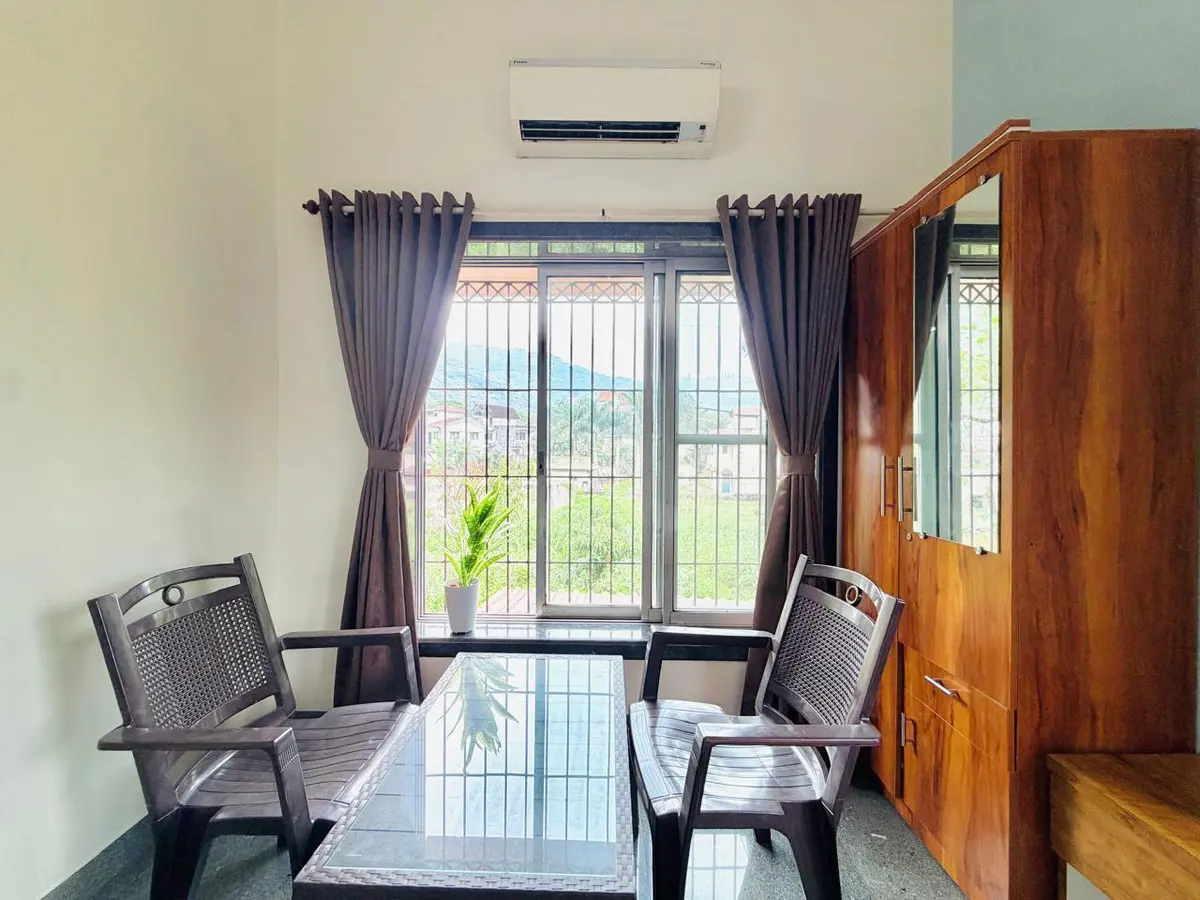 Air-conditioned bedroom in Elite Villa, a 4 BHK villa in Lonavala on rent