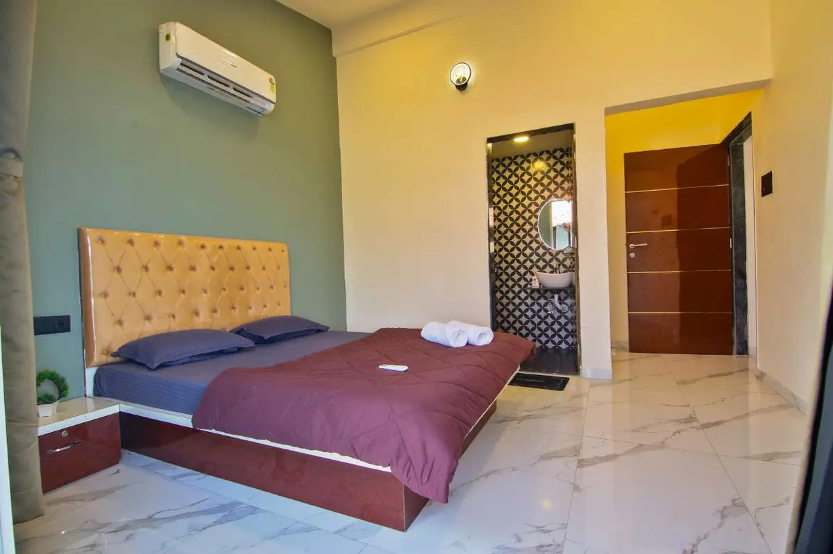 Air-conditioned bedroom in Shuubh Hillside 4BHK Villa, a 4 BHK villa in Lonavala on rent