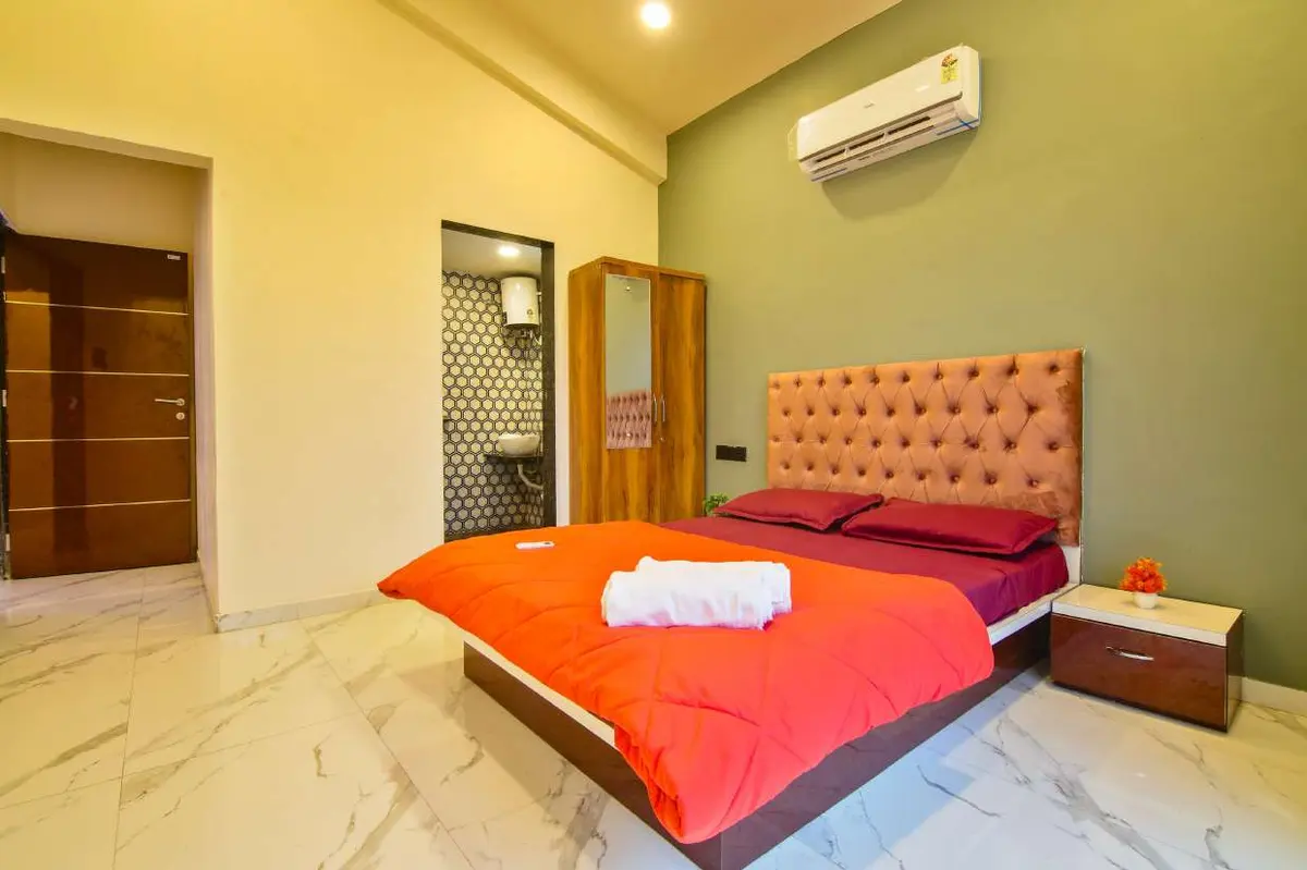 Air-conditioned bedroom in Shuubh Hillside 4BHK Villa, a 4 BHK villa in Lonavala on rent