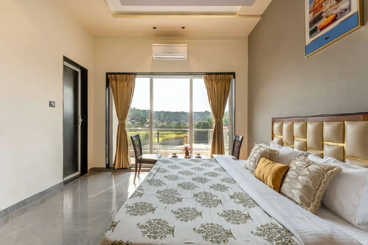 Air-conditioned bedroom in Shuubh Kaustubh 5BHK Villa, a 5 BHK villa in Lonavala on rent
