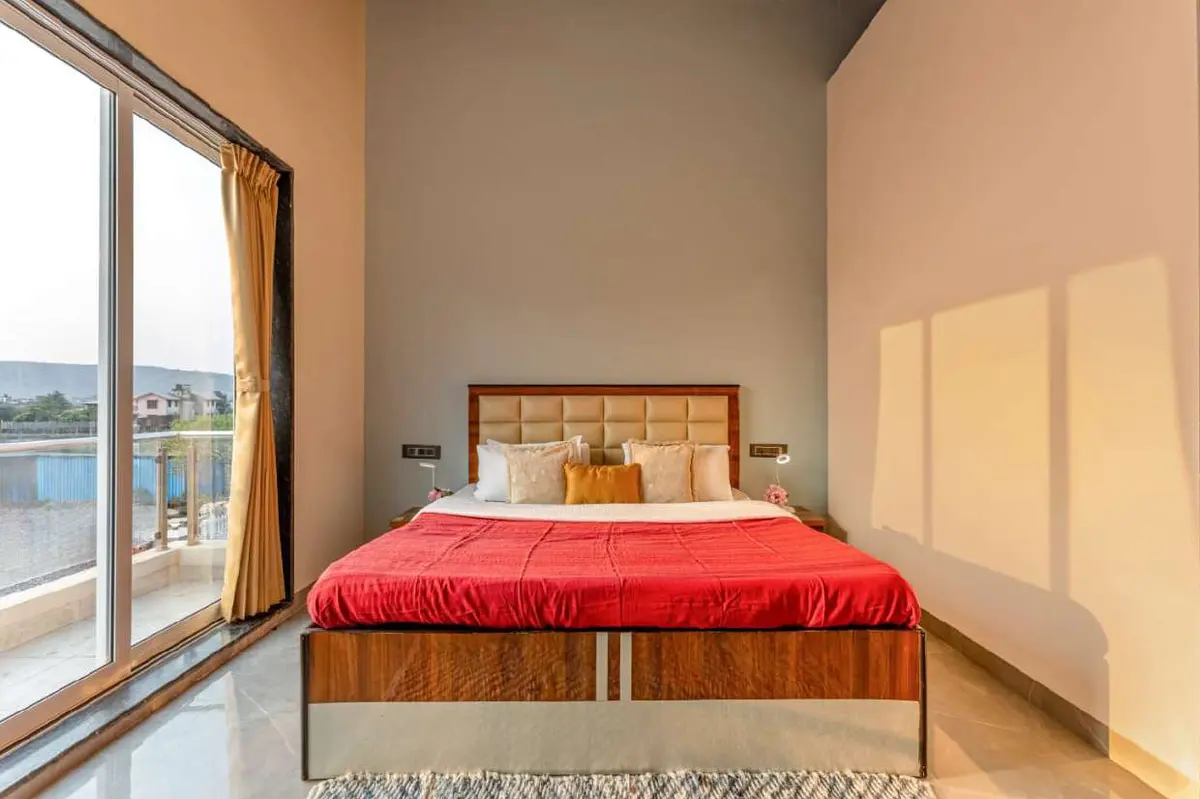Air-conditioned bedroom in Shuubh Kaustubh 5BHK Villa, a 5 BHK villa in Lonavala on rent