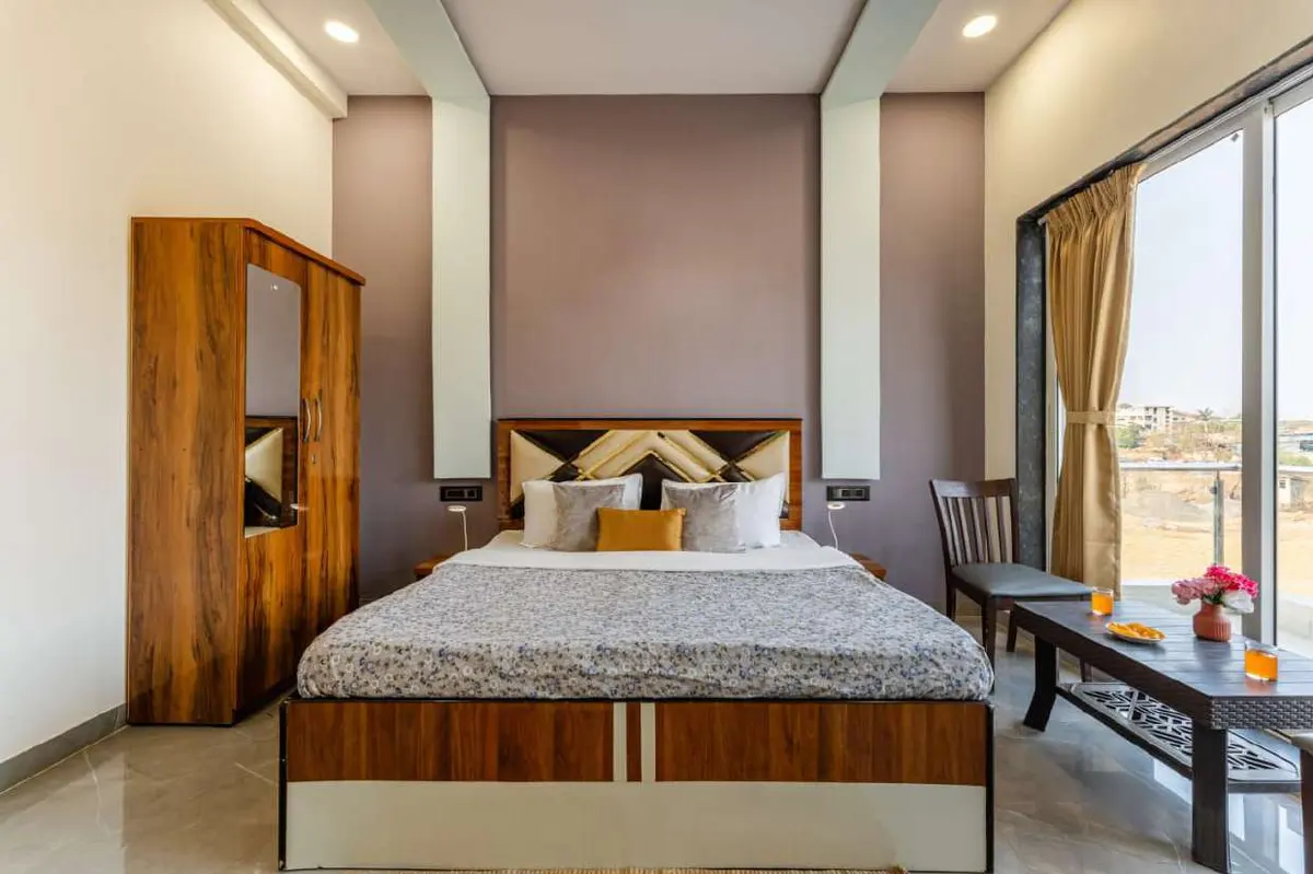 Air-conditioned bedroom in Shuubh Kaustubh 5BHK Villa, a 5 BHK villa in Lonavala on rent