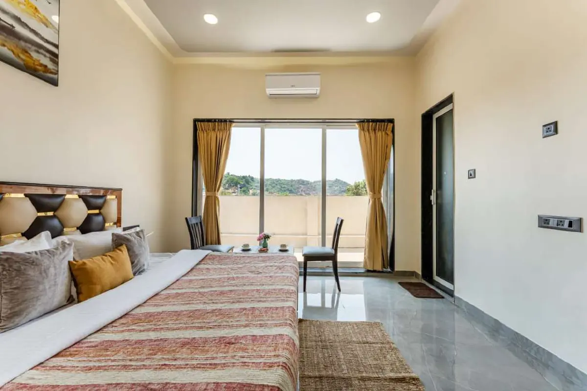 Air-conditioned bedroom in Shuubh Kaustubh 5BHK Villa, a 5 BHK villa in Lonavala on rent