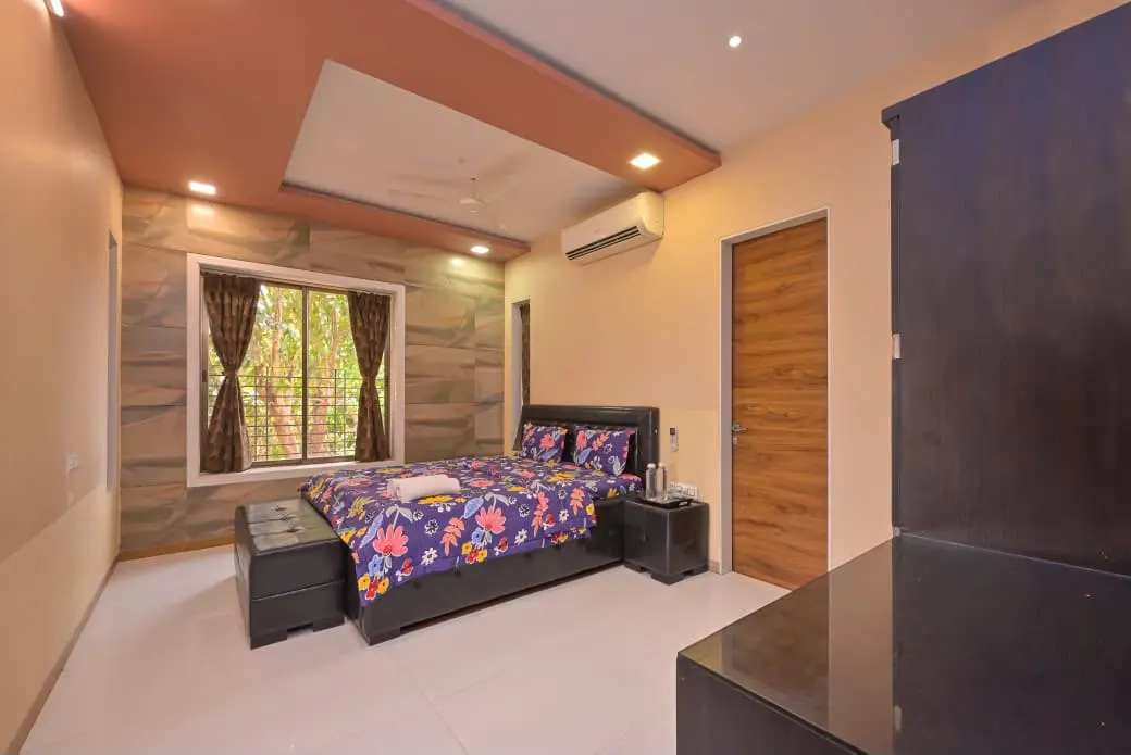 Air-conditioned bedroom in Shuubh Mountain Amber 5BHK Villa, a 5 BHK villa in Lonavala on rent