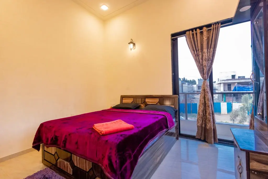 Air-conditioned bedroom in Rose Villa, a 4 BHK villa in Lonavala on rent