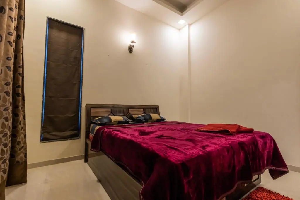 Air-conditioned bedroom in Rose Villa, a 4 BHK villa in Lonavala on rent