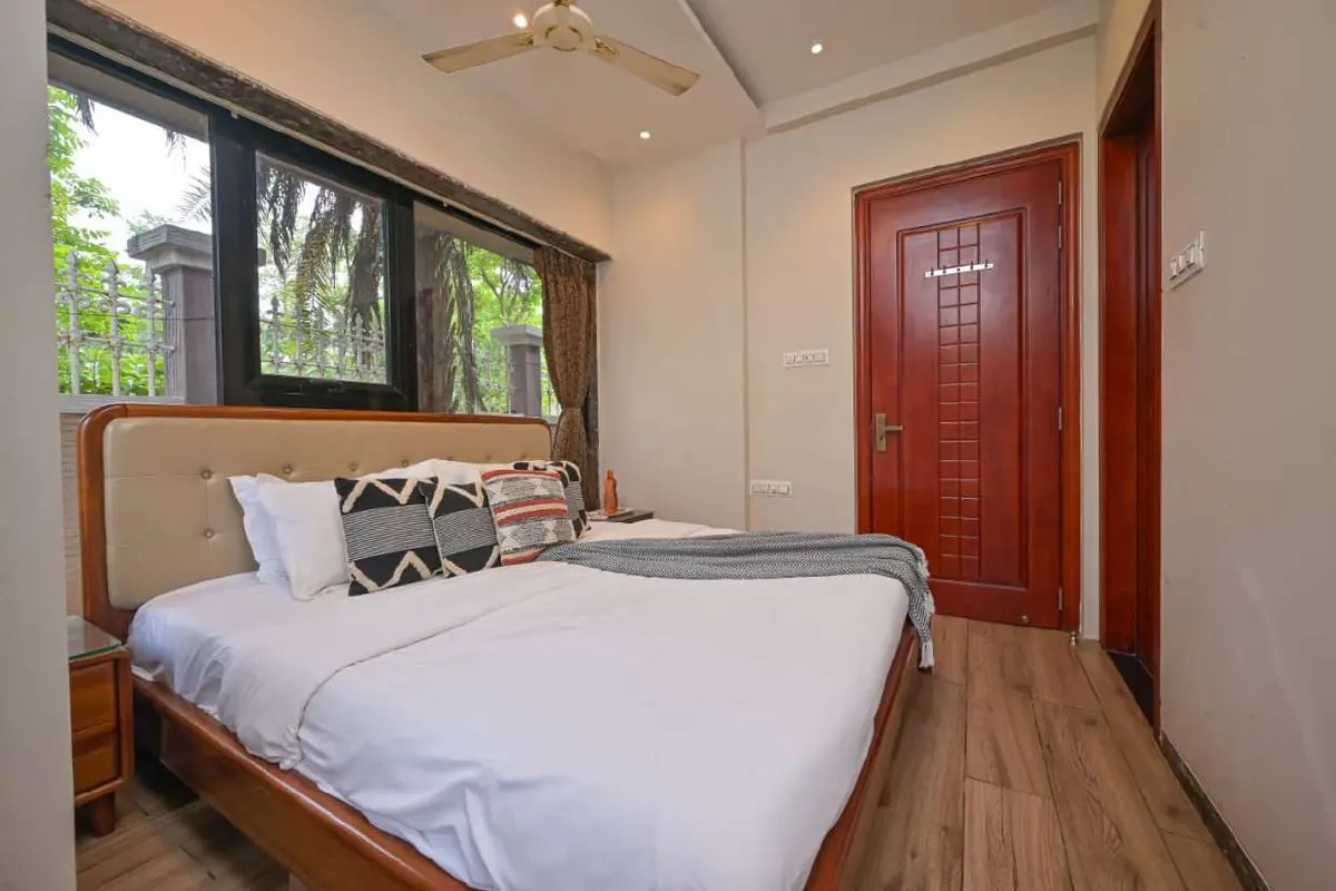 Air-conditioned bedroom in Shuubh Staycation 3BHK Villa, a 3 BHK villa in Lonavala on rent