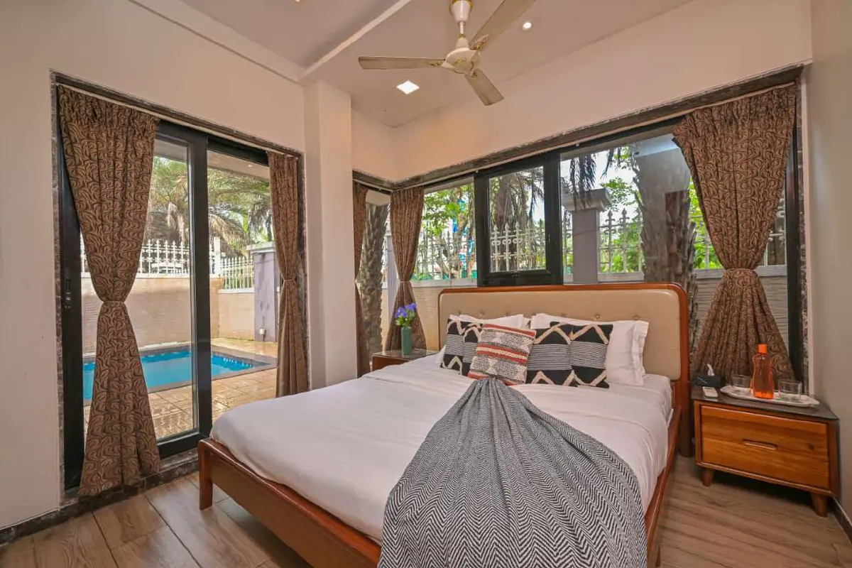 Air-conditioned bedroom in Shuubh Staycation 3BHK Villa, a 3 BHK villa in Lonavala on rent