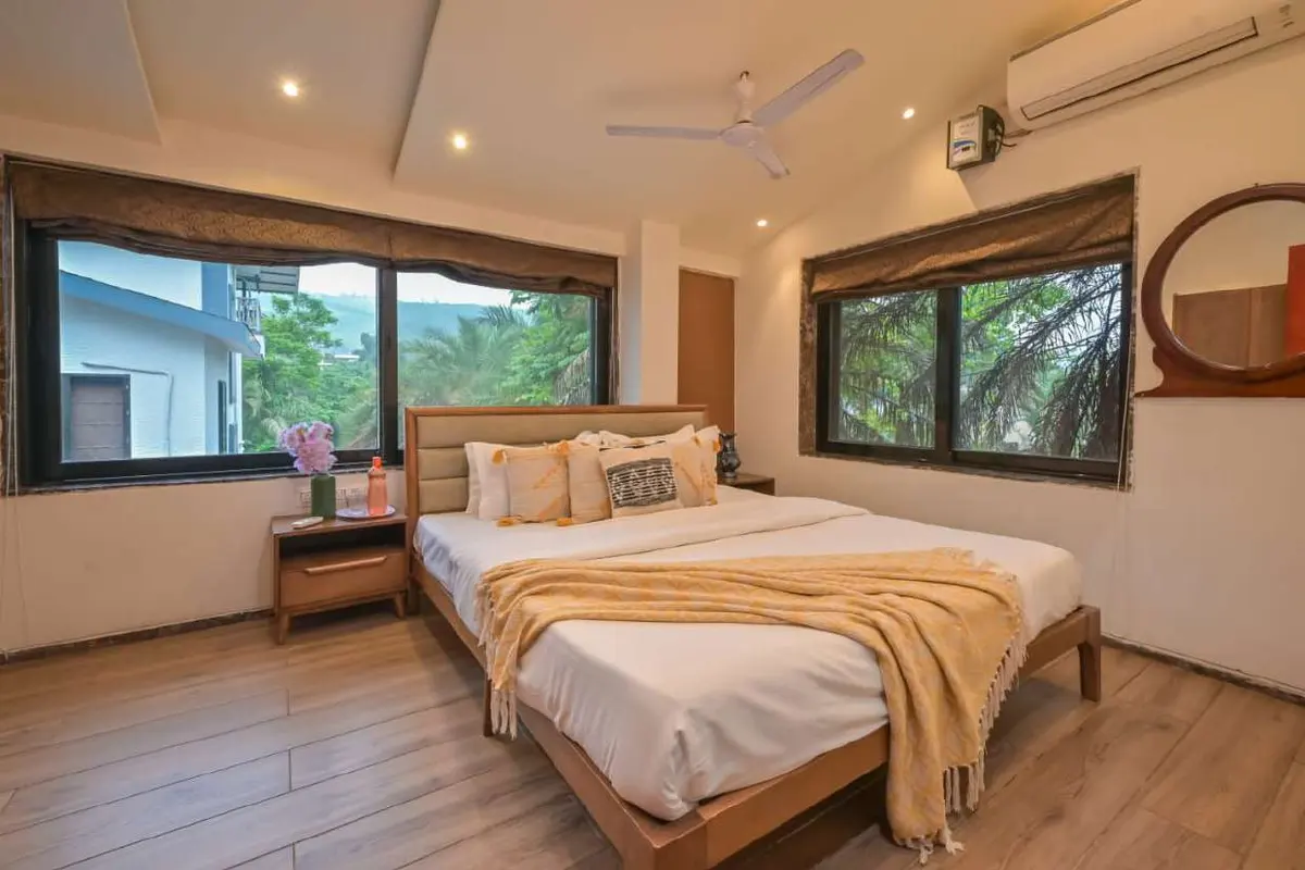 Air-conditioned bedroom in Shuubh Staycation 3BHK Villa, a 3 BHK villa in Lonavala on rent